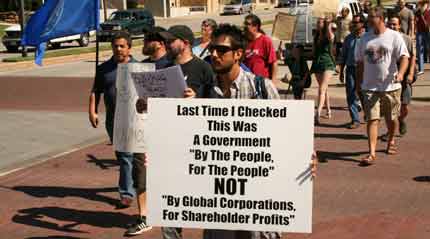marcher against corporate profits